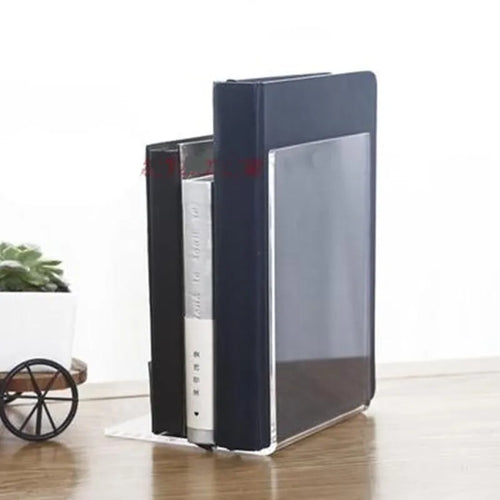 Clear transparent acrylic bookshelf holding a small stack of books on a desk.