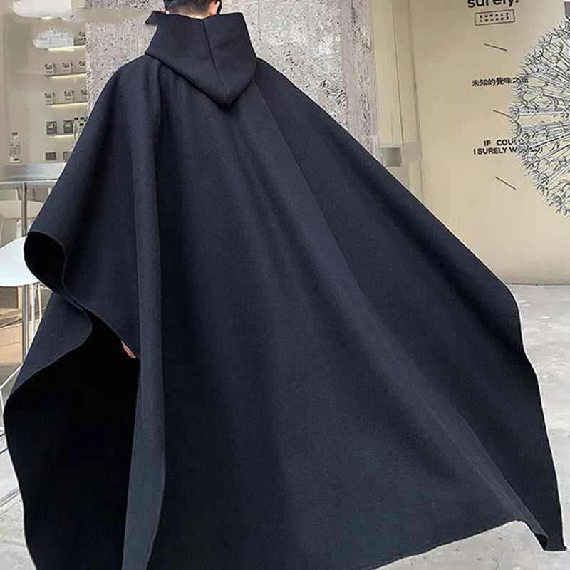 Men's black hooded cloak coat with loose punk streetwear design, front view
