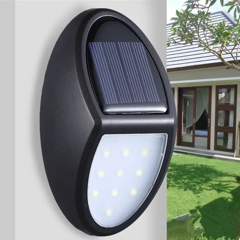 Black solar-powered LED wall light with automatic light sensor for outdoor use