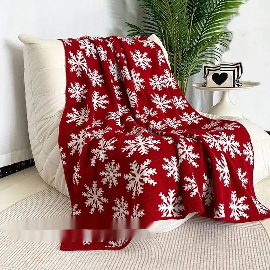 Personalised acrylic Christmas blanket with reindeer or snowflake print in two size options.