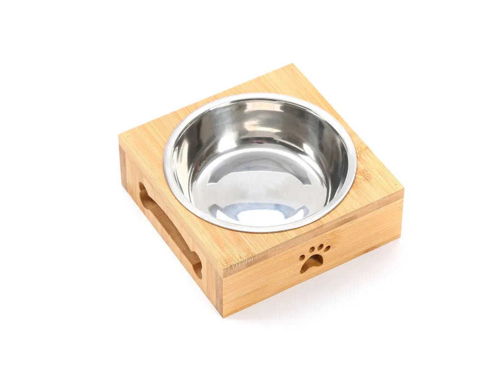 Solid wood pet feeding table with stainless steel bowls in a raised design for cats.