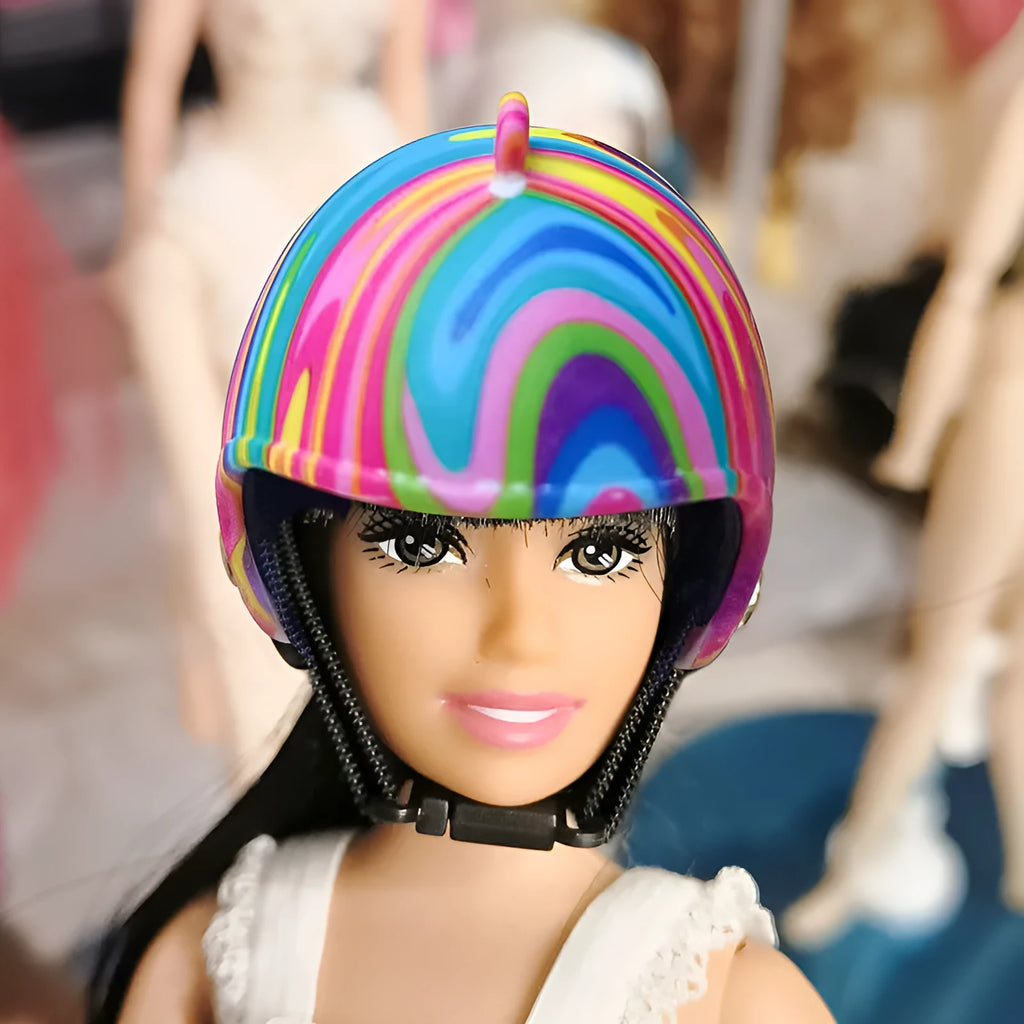 Assortment of small colourful plastic chicken helmets showing rainbow, zodiac, and patterned designs.