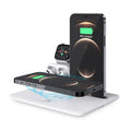 Black and white wireless charging desk stand holding a phone, smartwatch, and headphones.