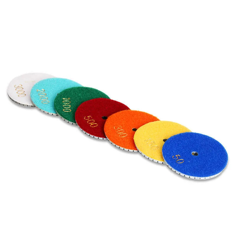 Set of 10 emery stone polishing pads with 80mm diameter and grits from 50 to 3000 mesh.