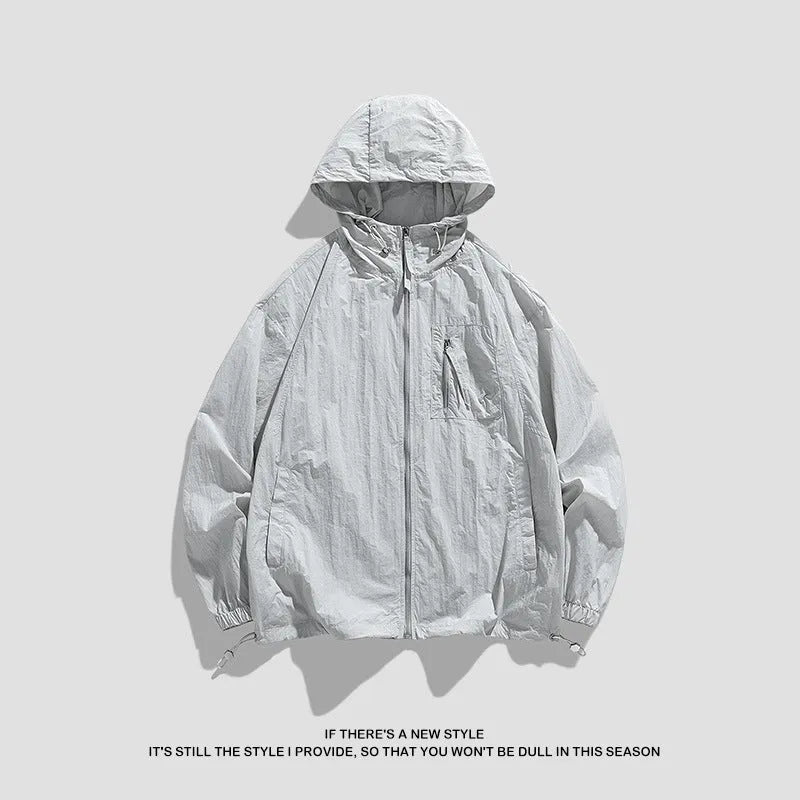 Lycra hooded sun protection jacket in light army green colour on a hanger