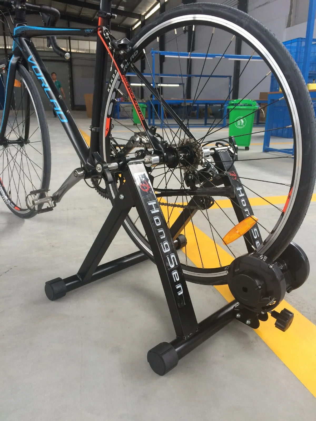 Indoor cycling training platform with magnetoresistance line control and fixed parking frame for 66-69cm bikes, black