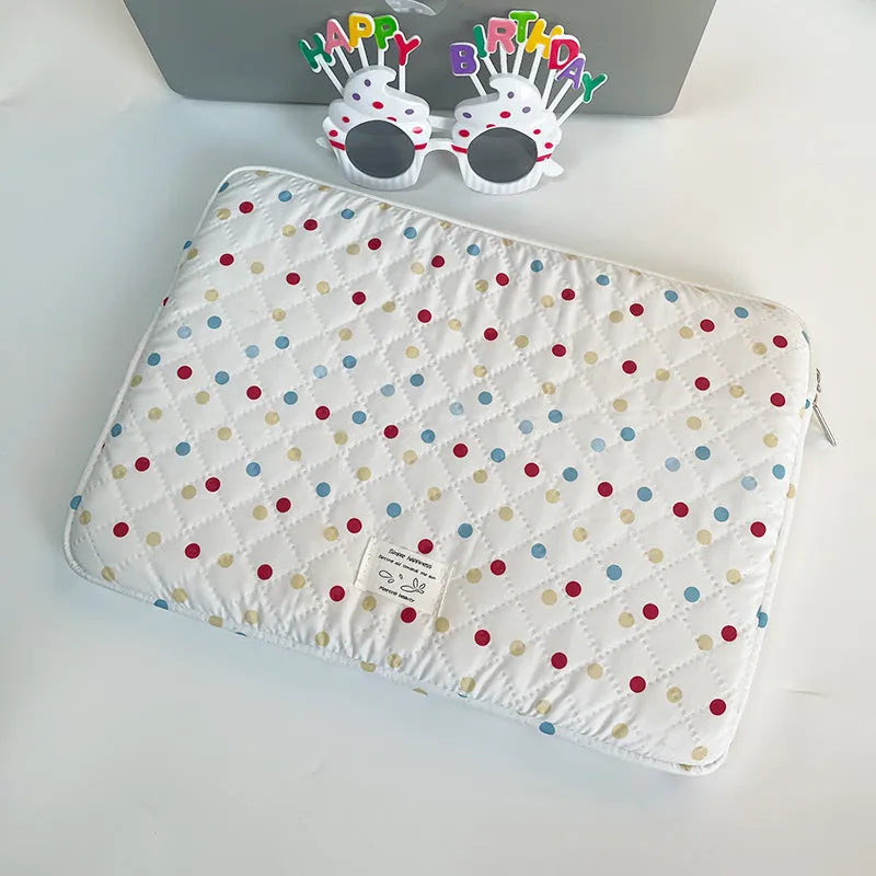 Polka dot patterned laptop bag for women, shown in available sizes for 11-inch to 15.6-inch laptops.