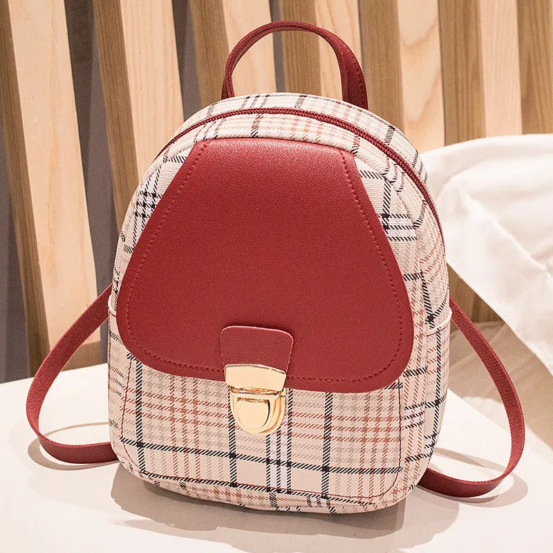 One shoulder diagonal phone bag in PU fabric shown in one of five colours: black, blue, brown, pink, or red.