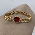 Retro oval small dial women's watch with gold alloy strap, shown in red dial and gold dial options