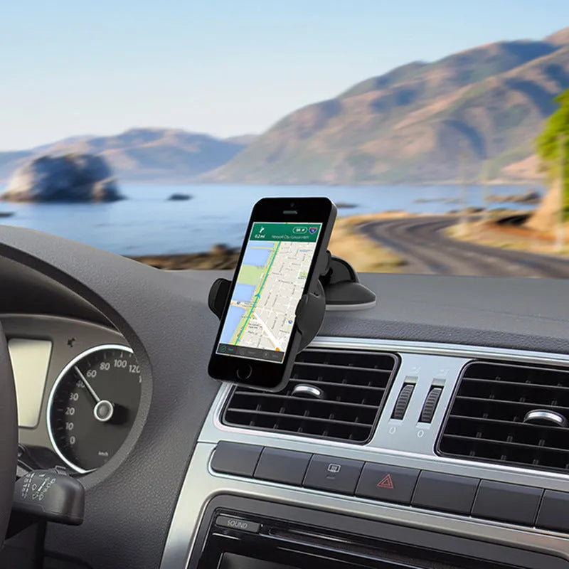 Black suction cup car phone holder holding a smartphone on car dashboard