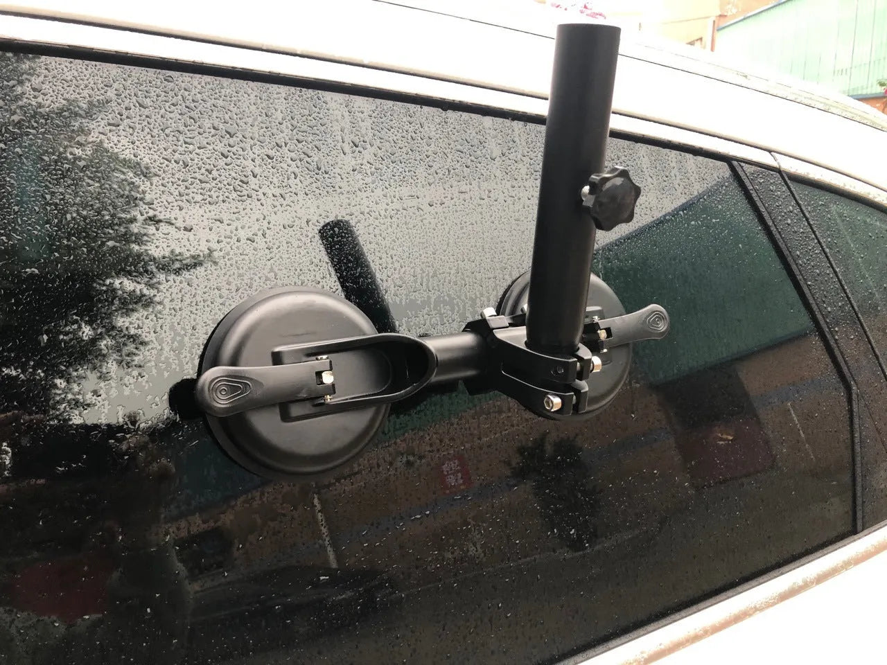 Black ABS off-road car sucker base with a round rubber sucker for mounting flagpoles on vehicle glass.