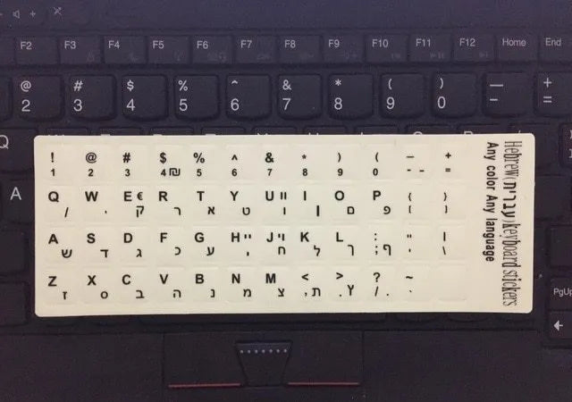 Yellow glowing PVC keyboard stickers with Arabic, Thai, Hebrew, French, Italian, and German language characters