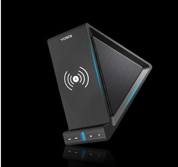 Black multifunctional power bank with integrated Bluetooth speaker and wireless charging phone stand on a desk.