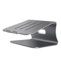 Silver aluminium laptop cooling stand with striped design on a wooden desk, rotated to show profile.