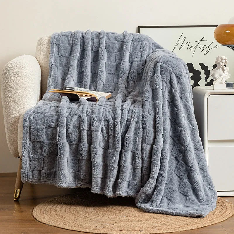 Geometric pattern polyester blanket in cream colour showing textured design and thickened construction