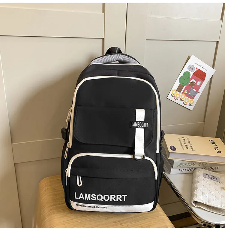 Waterproof nylon high school student backpack in choice of colours, showing pendant and no-pendant styles.