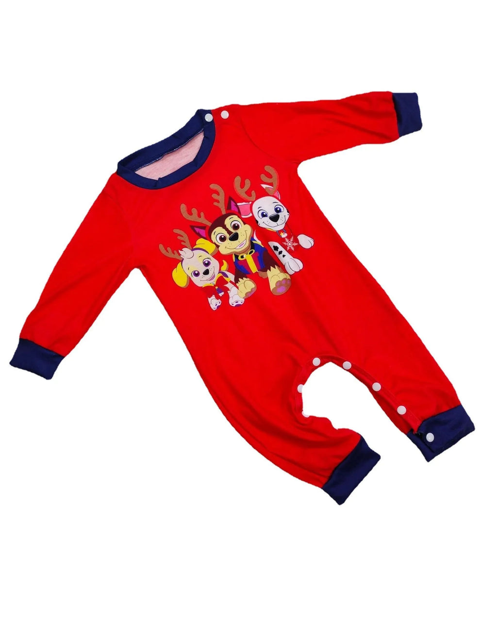 Family wearing matching red plaid Christmas pajamas with deer motif, including parents, children, and a dog.