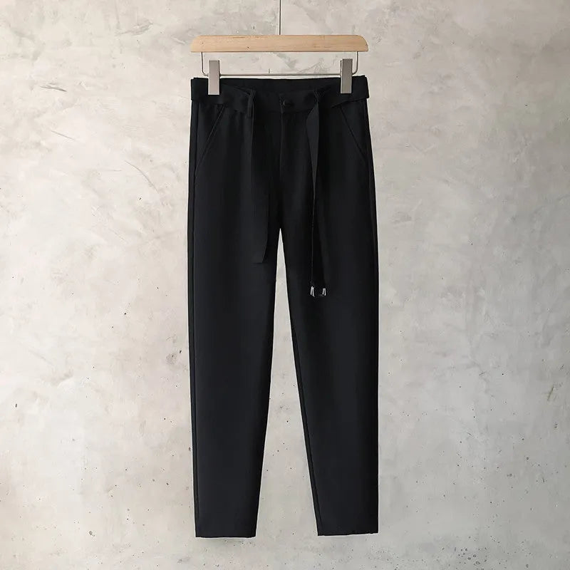 Boys slim straight wool trousers in tapered fit, shown in light grey colour.