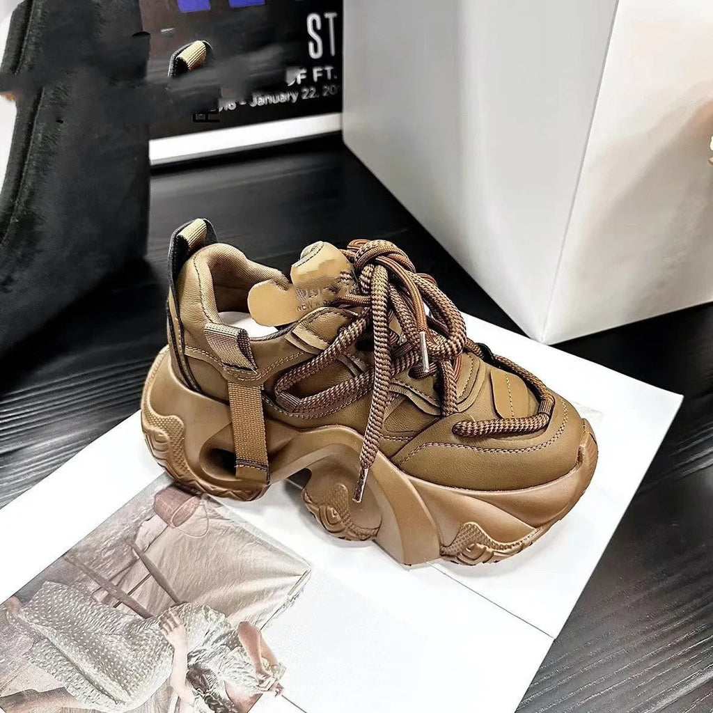 Women's creamy white casual sneakers with a wedge sole, cross straps, and round toe on a light background.