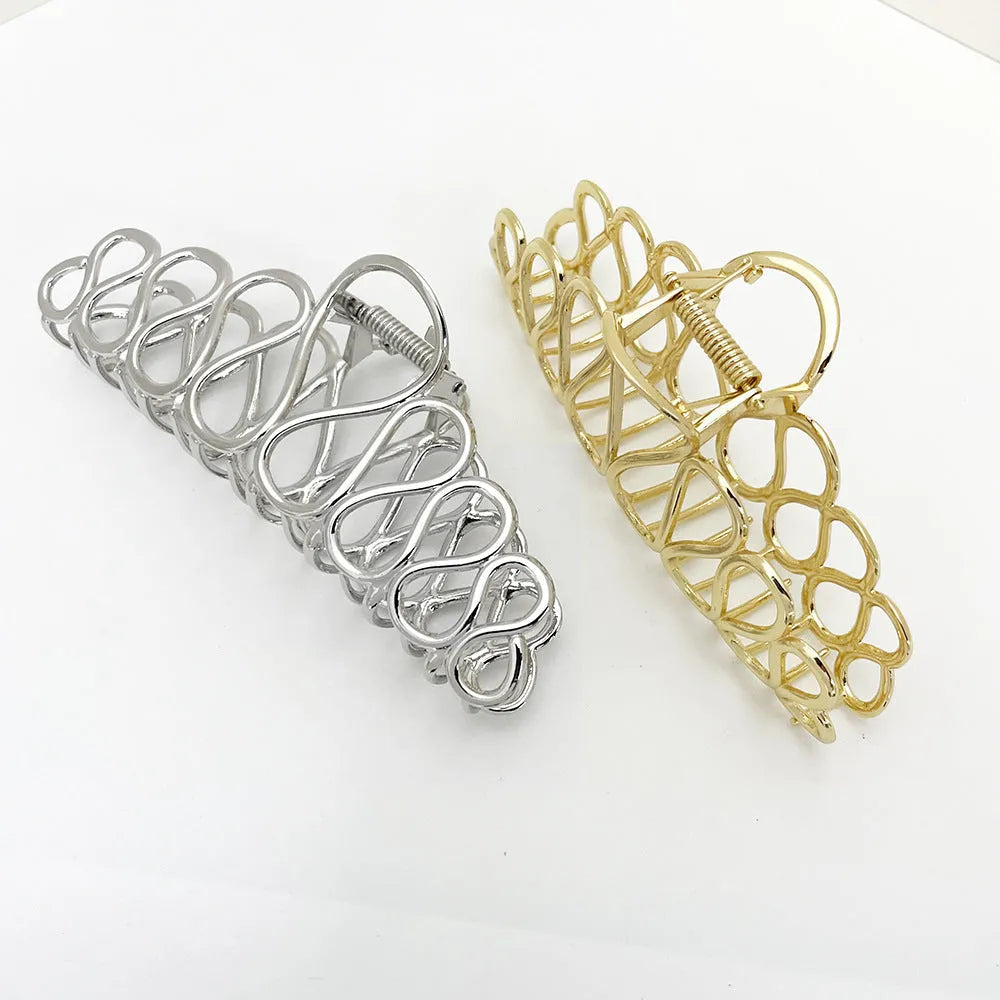 Minimalist large updo hair clip with tassel detail in gold or silver electroplated alloy