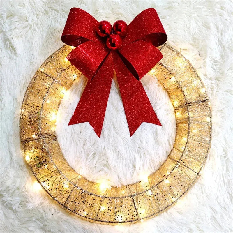 50cm gold and green Christmas garland with LED lights and bowknot on a door