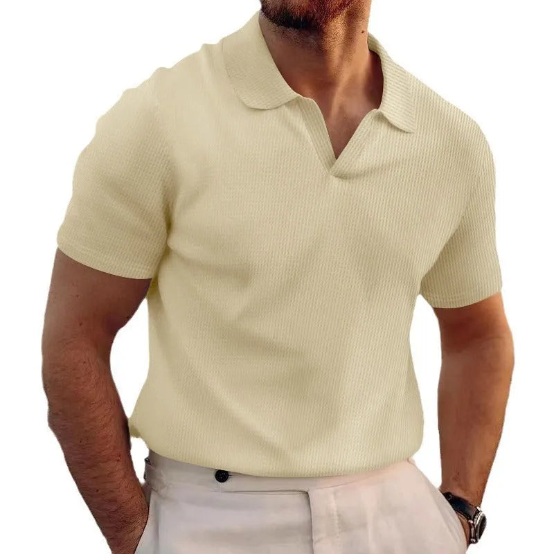 Man wearing a slim fit black heavy waffle knit t-shirt with short sleeves.