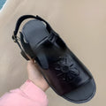Men's black embroidered floral beach sandals with a flat heel and PU leather upper.