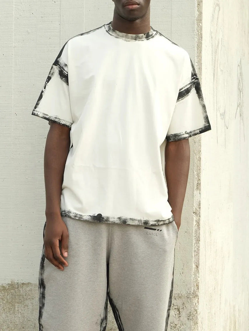 White casual short sleeve top with draped design and printed pattern