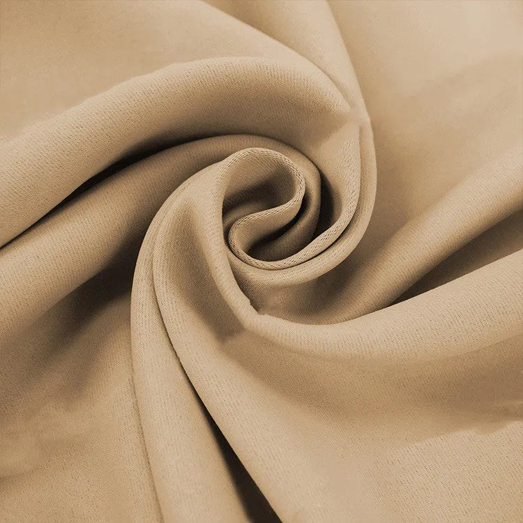 Full blackout polyester curtain with black lining, perforated top, beige colour, lying flat on surface
