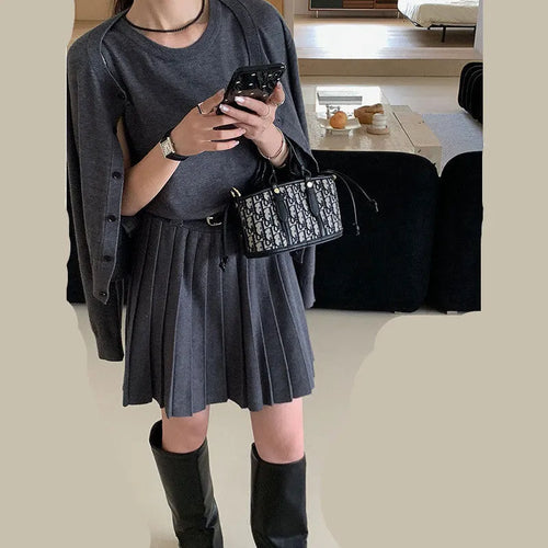 Grey knitted women's two-piece set with vest skirt, long-sleeved cardigan and pleated detail