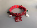 Green rope P chain dog leash with a metal release buckle fastened to a dog collar.