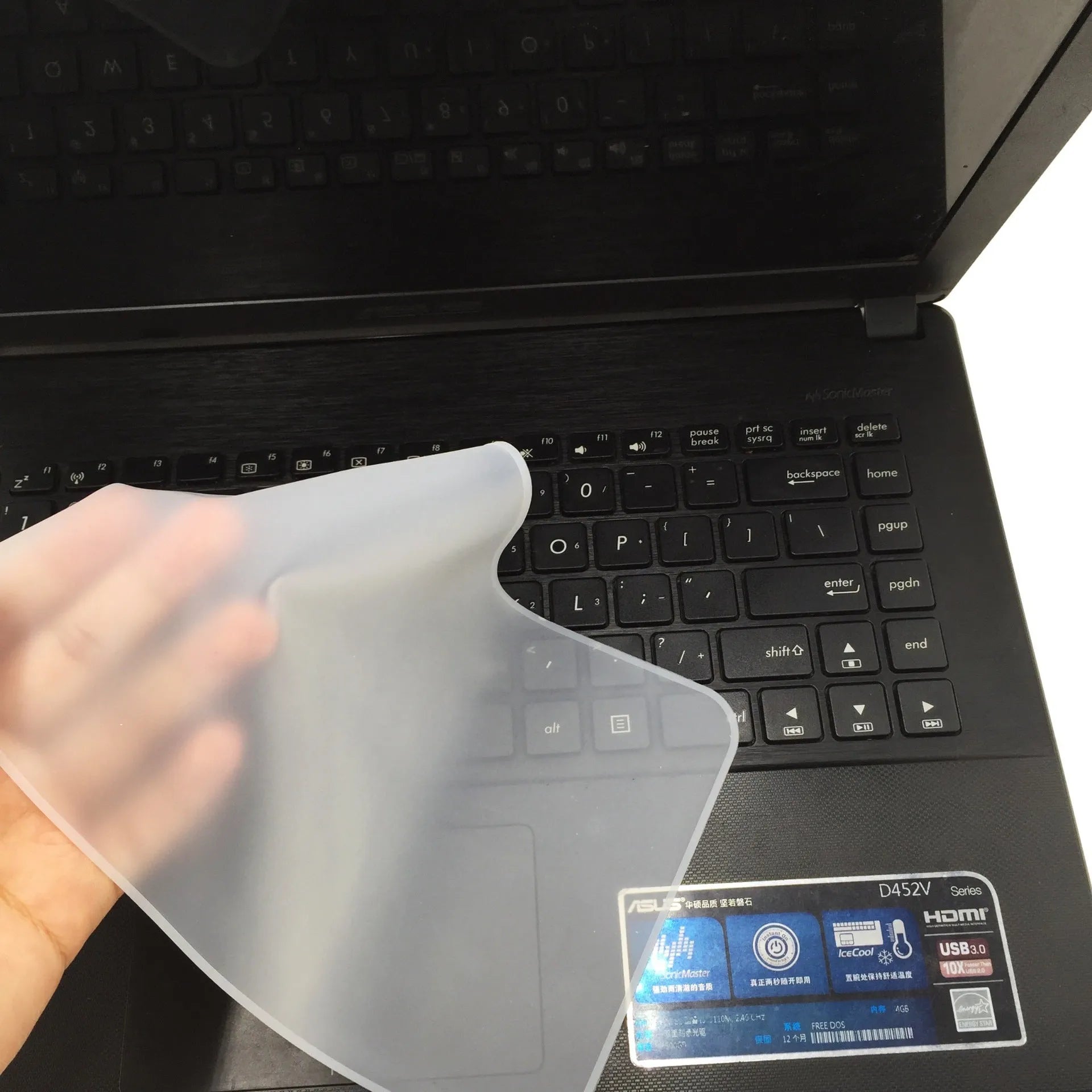 Transparent silicone laptop keyboard dust film on a notebook close-up