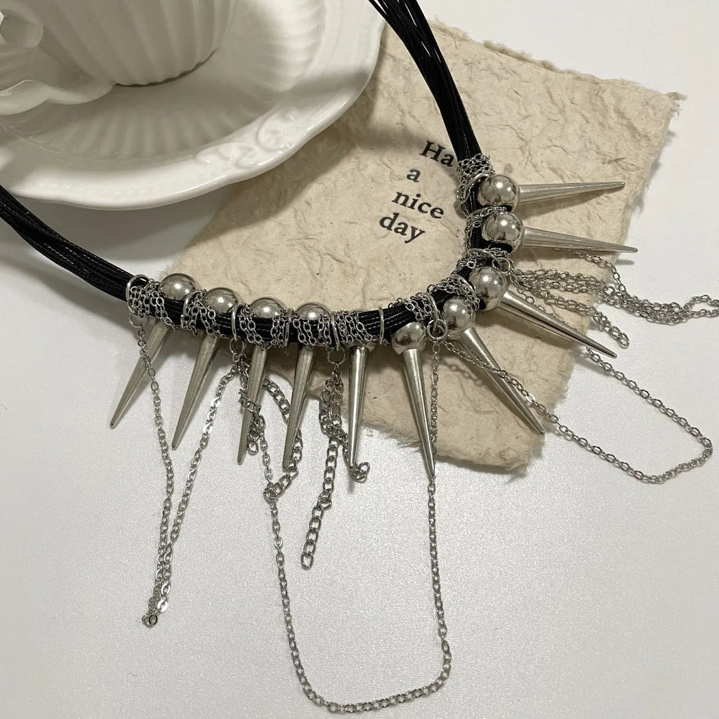 Women's leather necklace with electroplated rivet detail and winding tassel round beads design