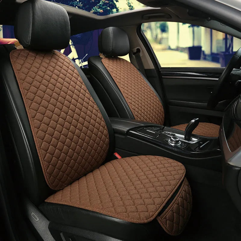 Linen car seat cushion with memory foam in Warm Cream colour on a car seat.
