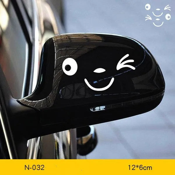 A pair of reflective cartoon eye car stickers made from PET vinyl, designed for vehicle body or rearview mirror.