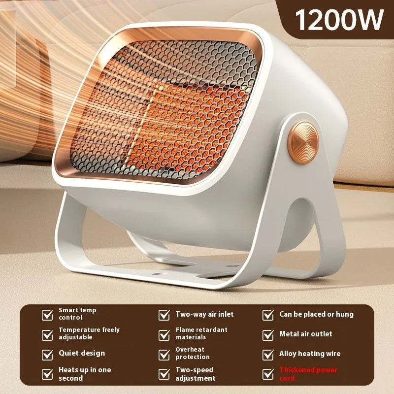 A compact grey desktop electric heater with a rotatable base on a table.