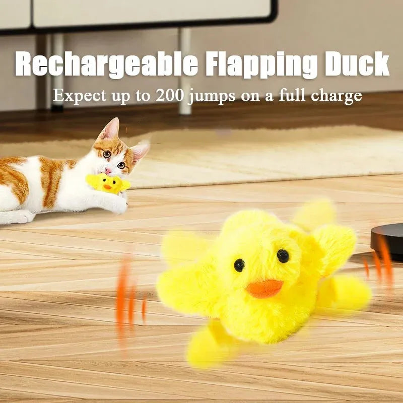Yellow flapping duck cat toy with USB charging cable on wooden floor