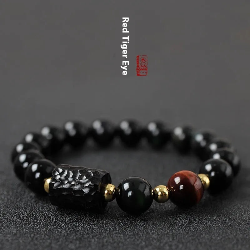Handmade obsidian bracelet with 10mm yellow tiger eye beads in circular retro design