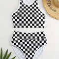 Adult female backless racing swimsuit with suspender straps in checkerboard print pattern