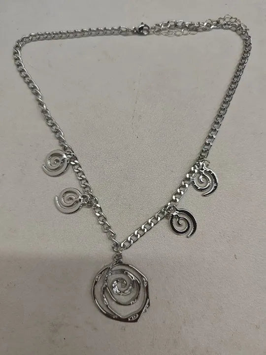 Spiral donut women's jewellery set showing necklace, bracelet, and earrings with geometry circle design