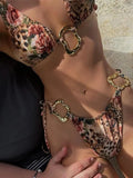 Women's halter neck bikini set with lace-up front on the top and low waist briefs in a solid colour.