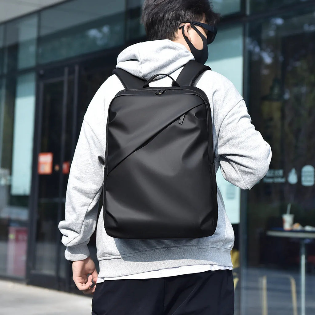 Large capacity waterproof PU leather backpack in black colour with sewing thread detailing