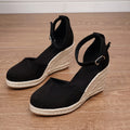 Women's apricot and black wedge sandals with suede upper and buckle closure on rubber sole
