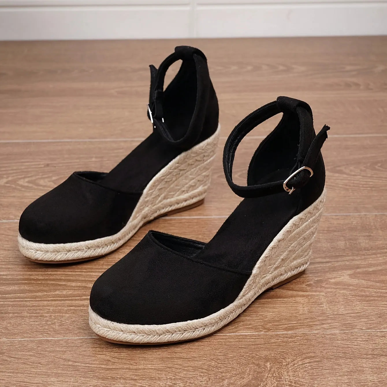 Women's apricot and black wedge sandals with suede upper and buckle closure on rubber sole