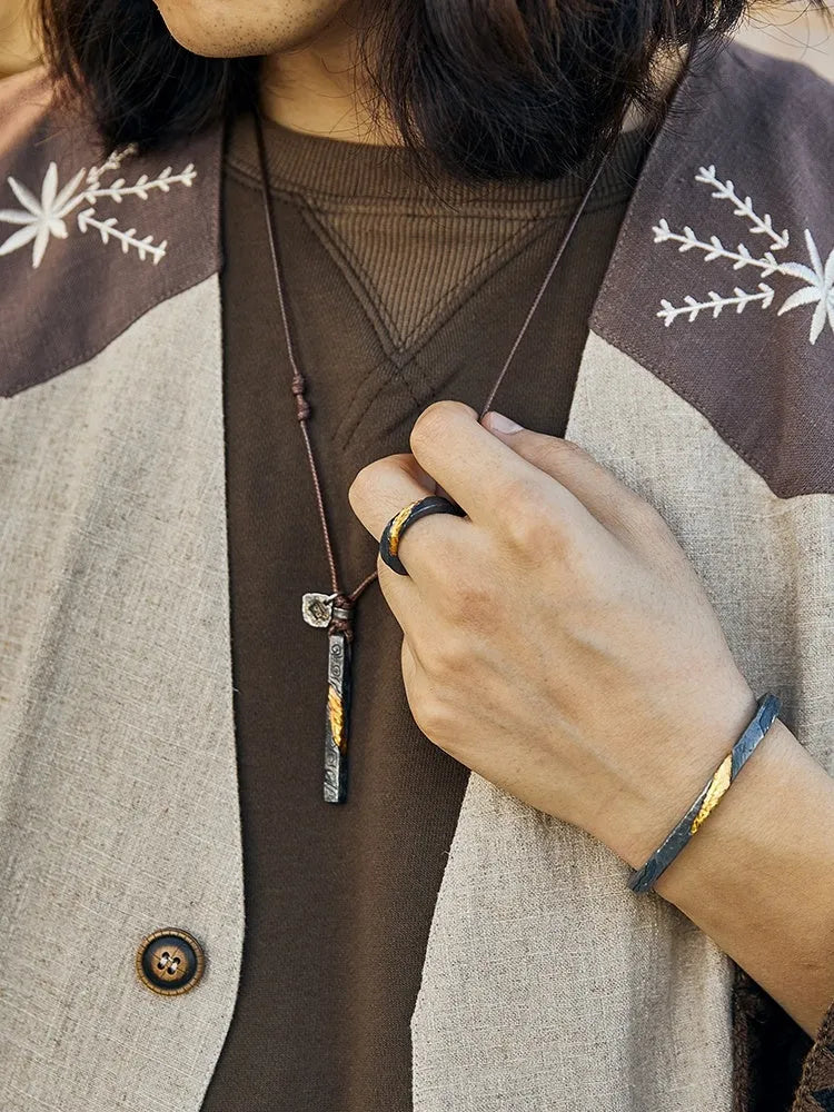 Handmade sterling silver men's necklace with gold inlay and gemstone detail