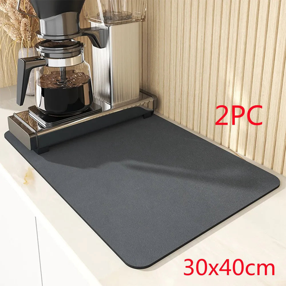Square kitchen drain pad mat with black PU leather surface showing liquid absorption and rubber anti-slip backing