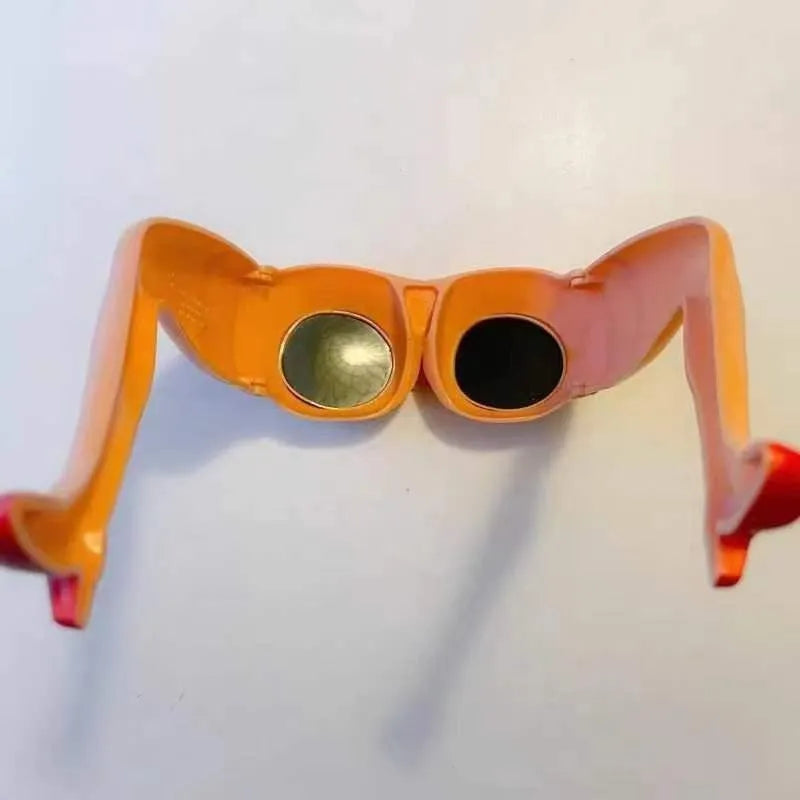 Orange novelty sunglasses with sculpted plastic leg attachments wrapped around head model.