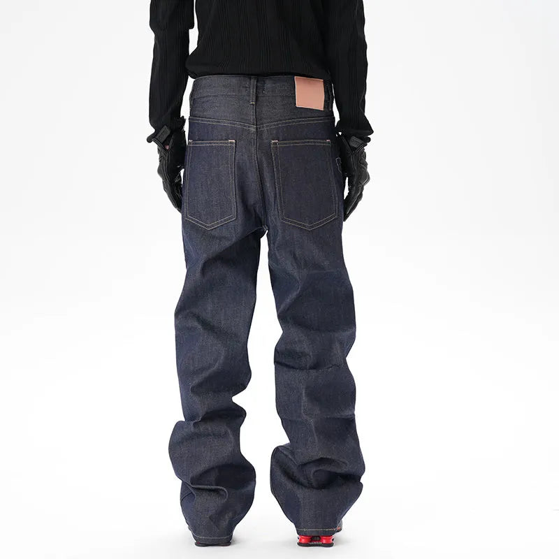 Dark blue loose straight-leg casual jeans on a neutral background.