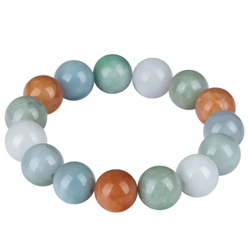 Close-up of a women's bracelet with round 13mm Myanmar jade beads in three colours.