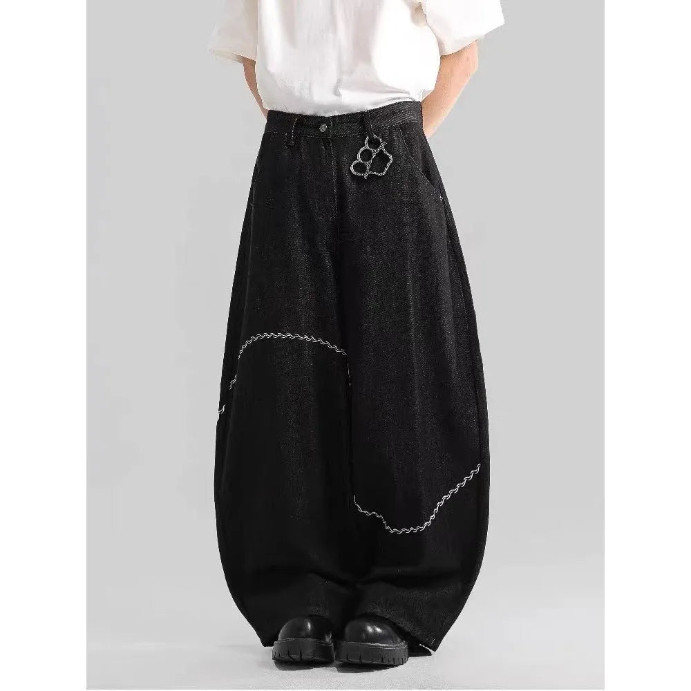 Black men's straight-leg denim trousers with a mid-rise waist and zip fly.